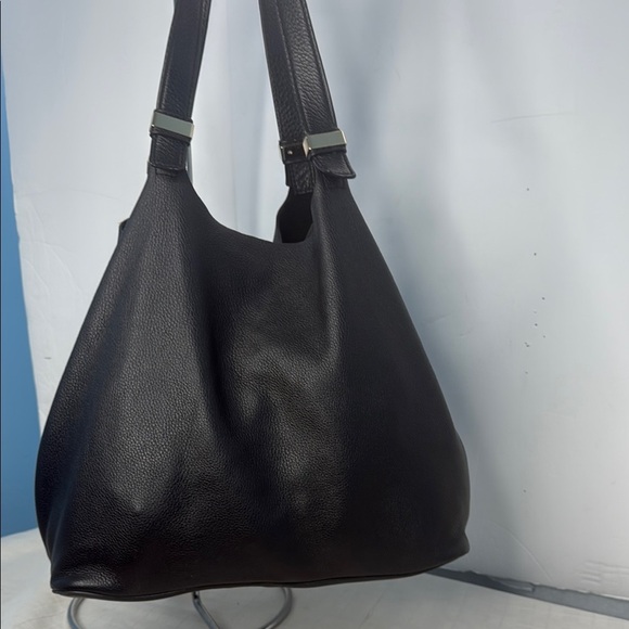 The image shows a Michael Kors Colgate Reversible Grab Bag in black. - Picture 4 of 11